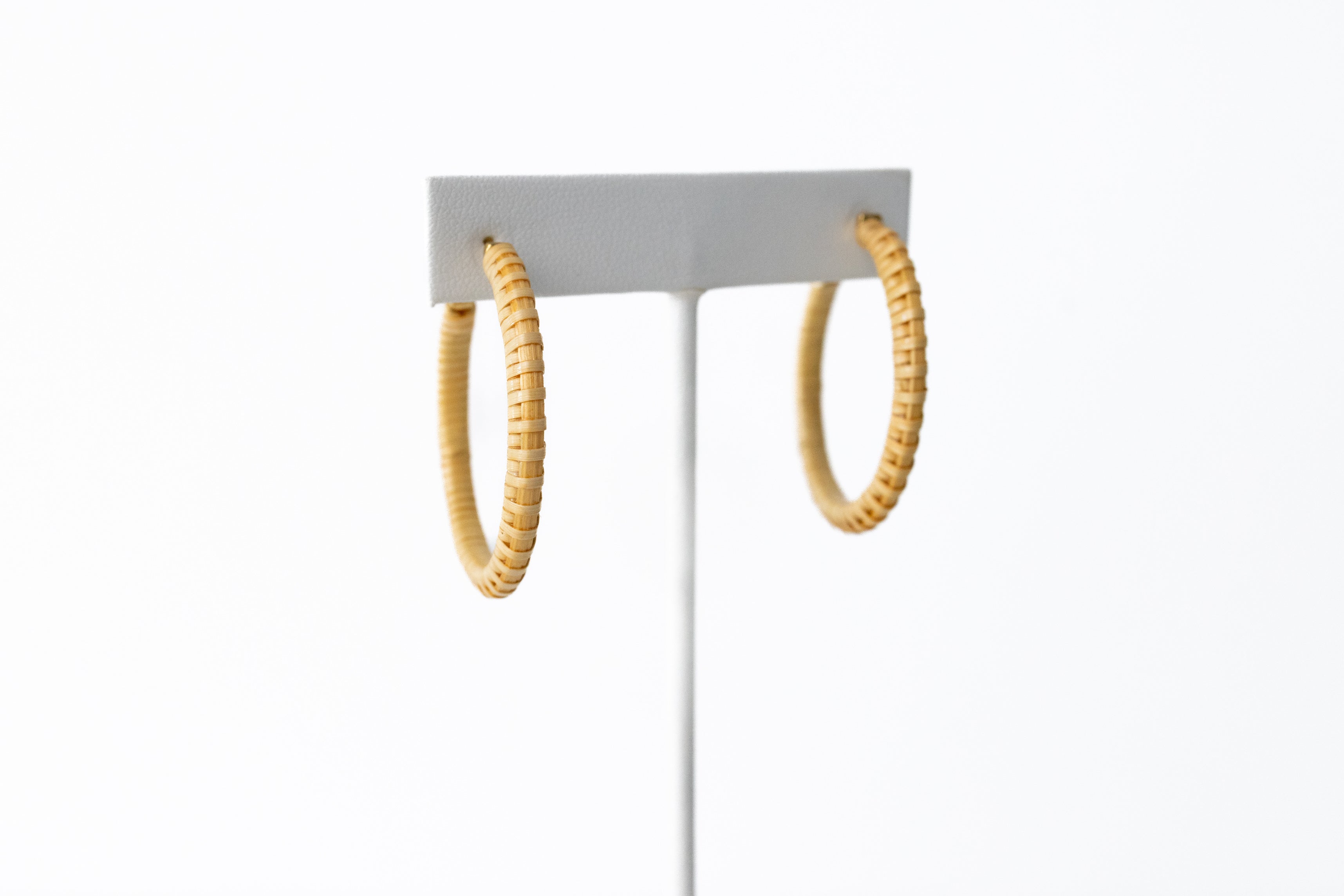 A front facing view of the handcrafted single stave earrings.