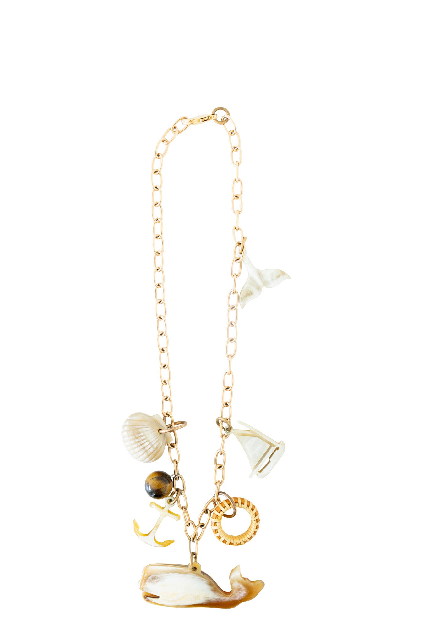 A necklace with a gold-linked chain and six nautical charms made from buffalo horn.