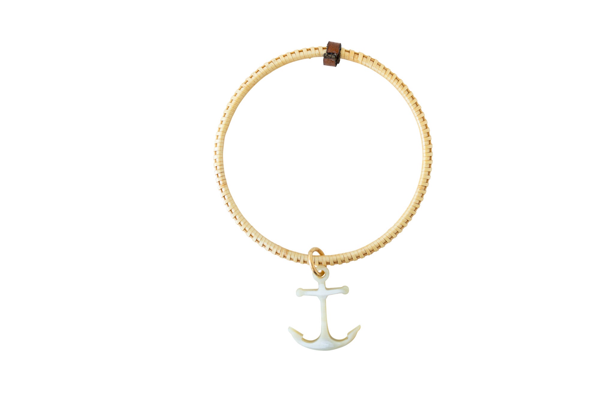 Handcrafted bangle with an anchor charm.