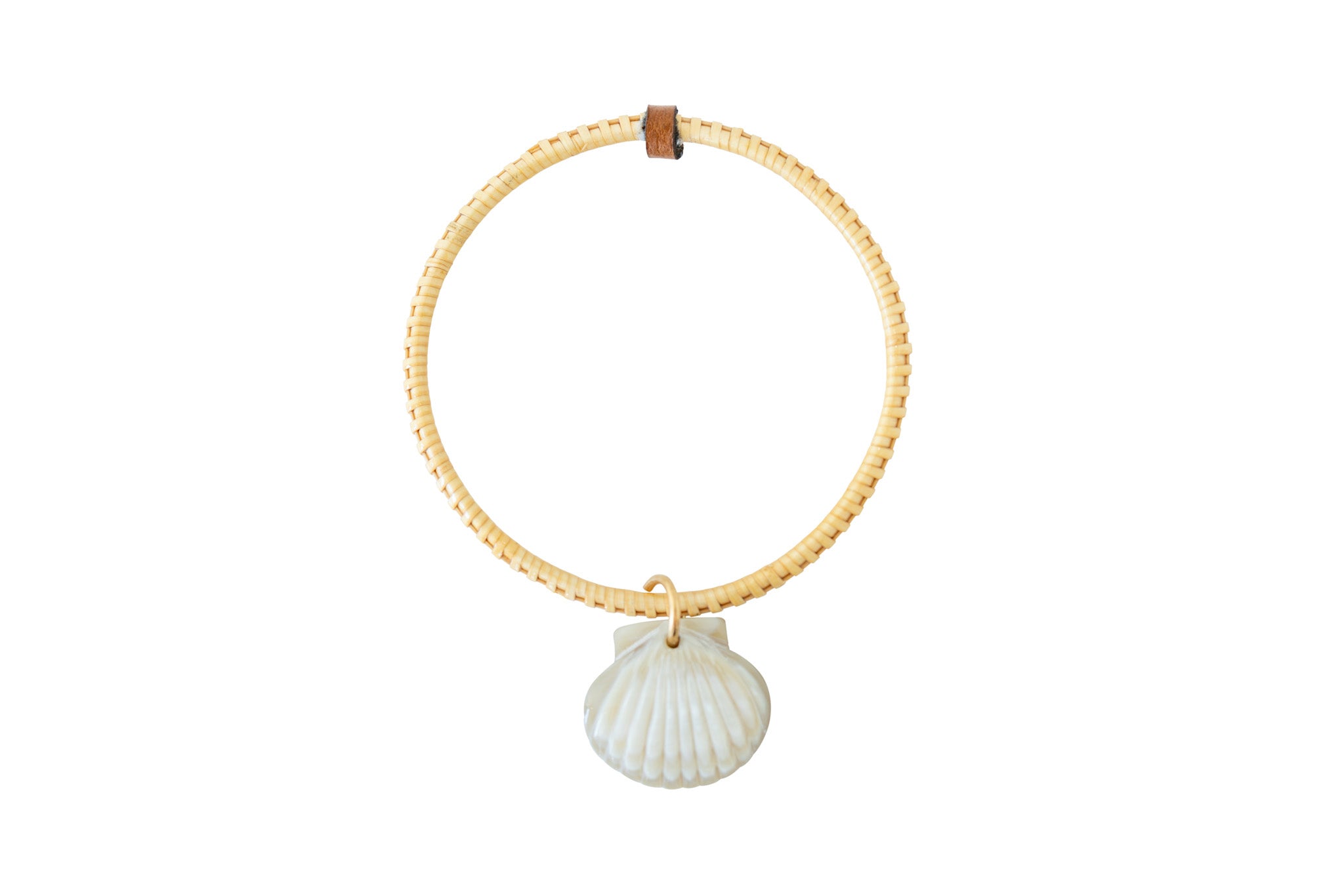 Handwoven bracelet with seashell charm.