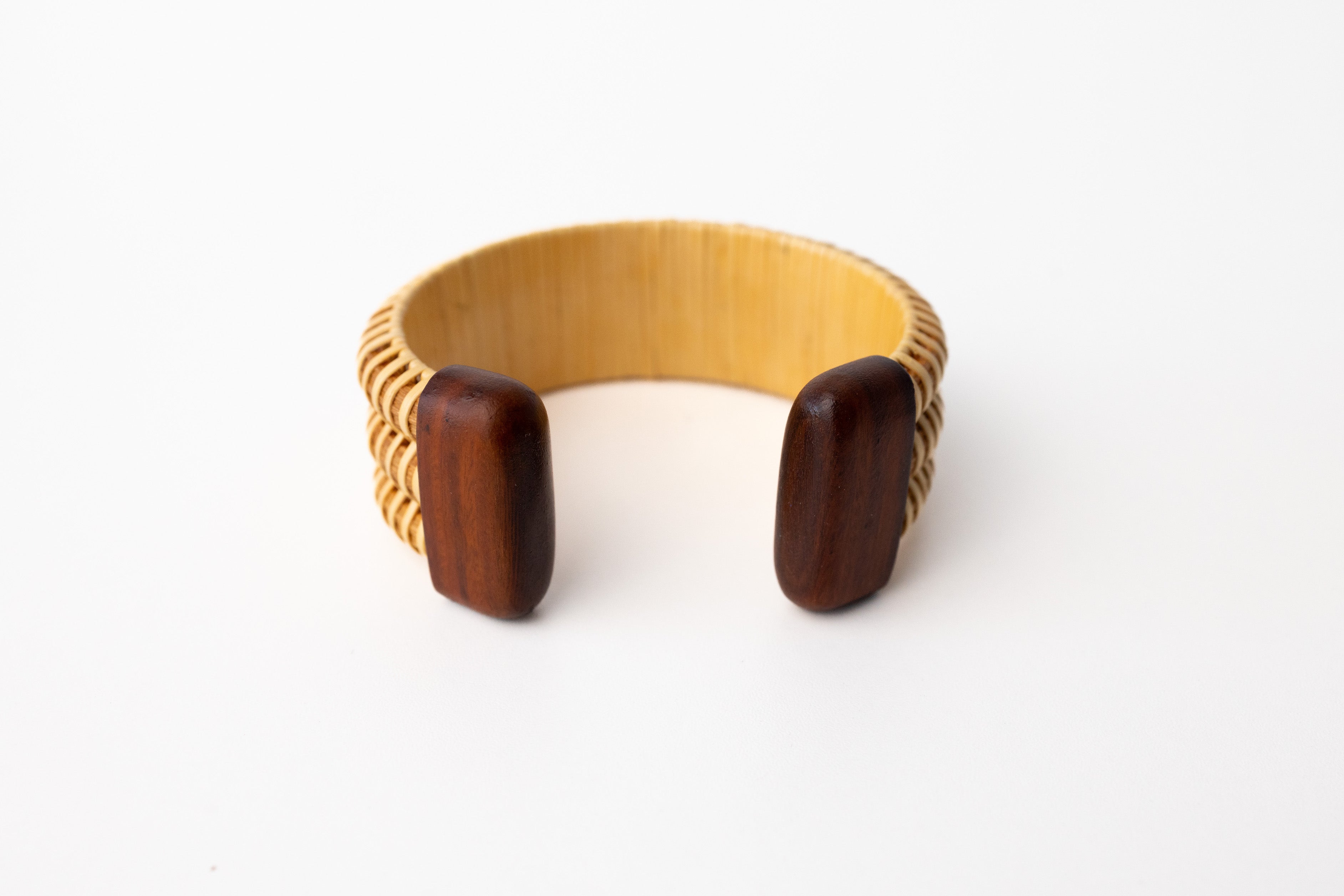 The inside of the Wooden Nantucket cuff, featuring the cherry hardwood finish.