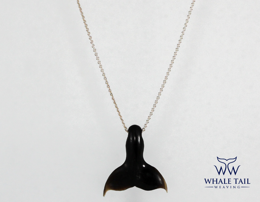 Nantucket Whale Tail Pendant on a silver chain.