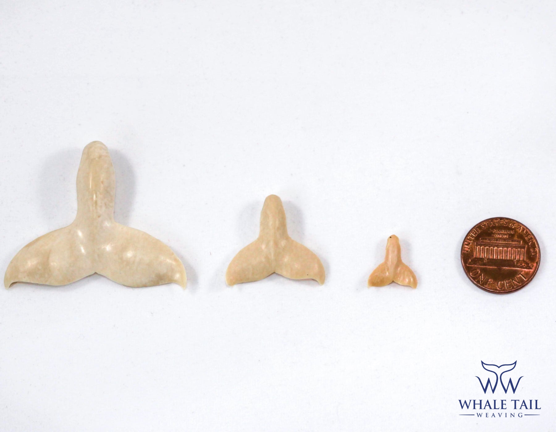 Nantucket Whale Tail Pendant size in comparison to a penny.