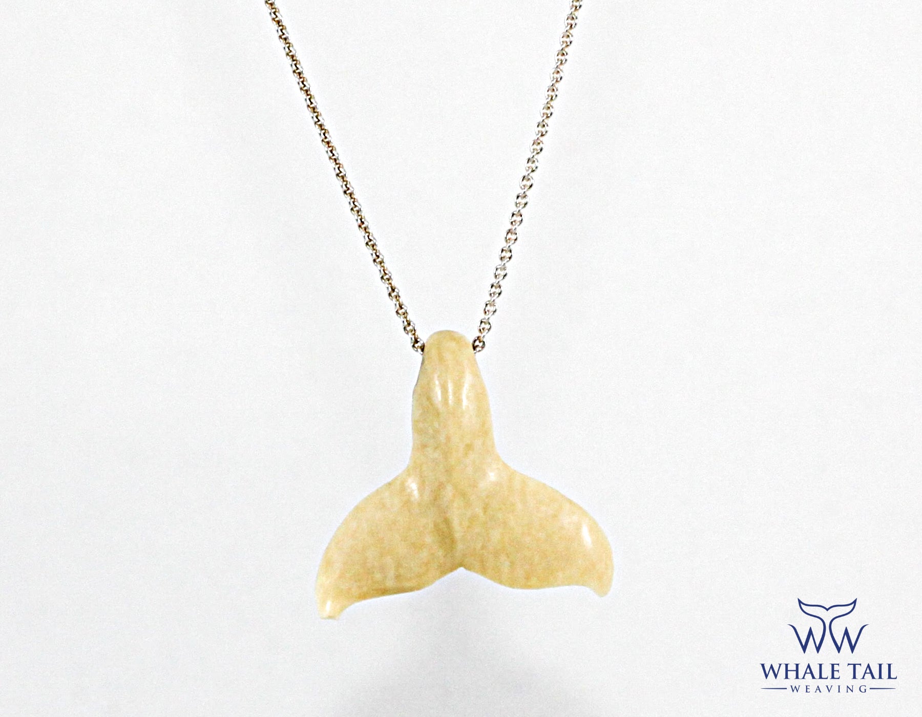 Close up of a Whale Tail Nantucket Pendant
