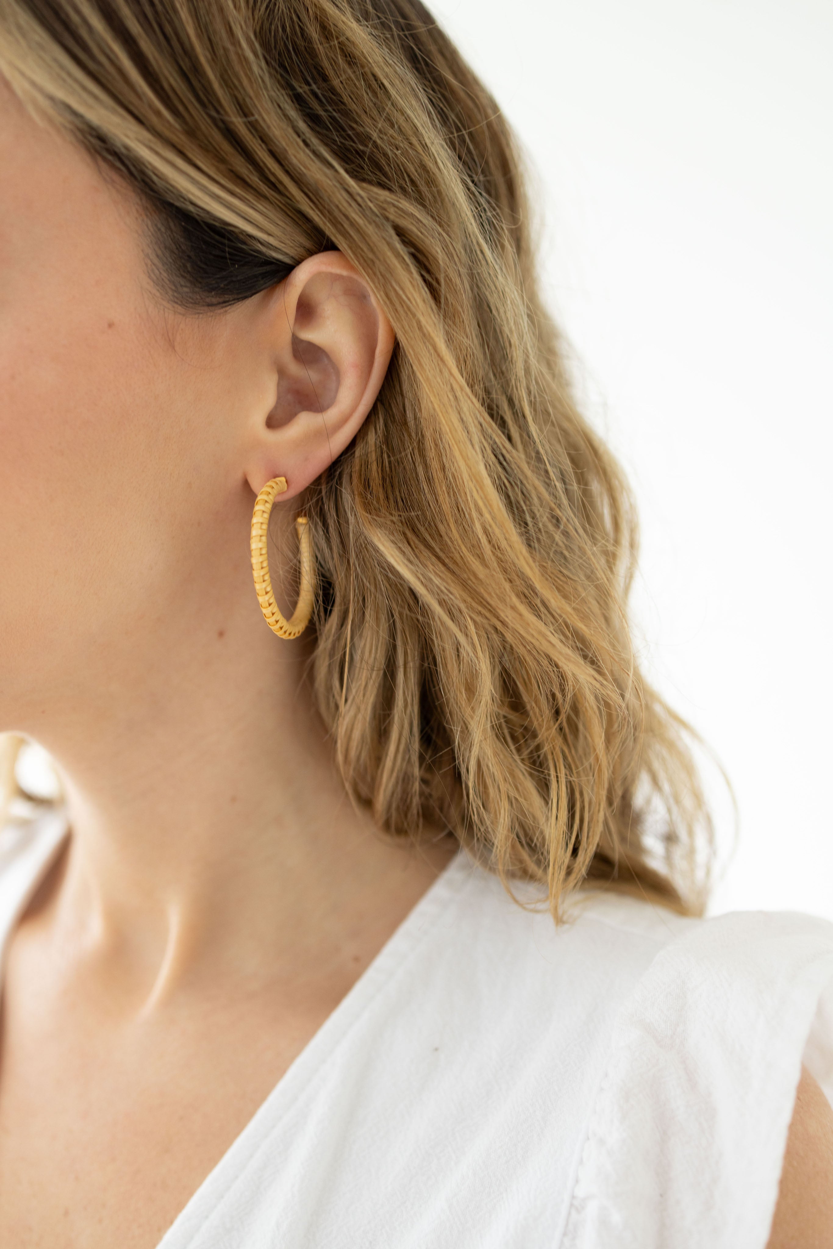 Woman wearing Whale Tail Weaving Hoop Earrings 