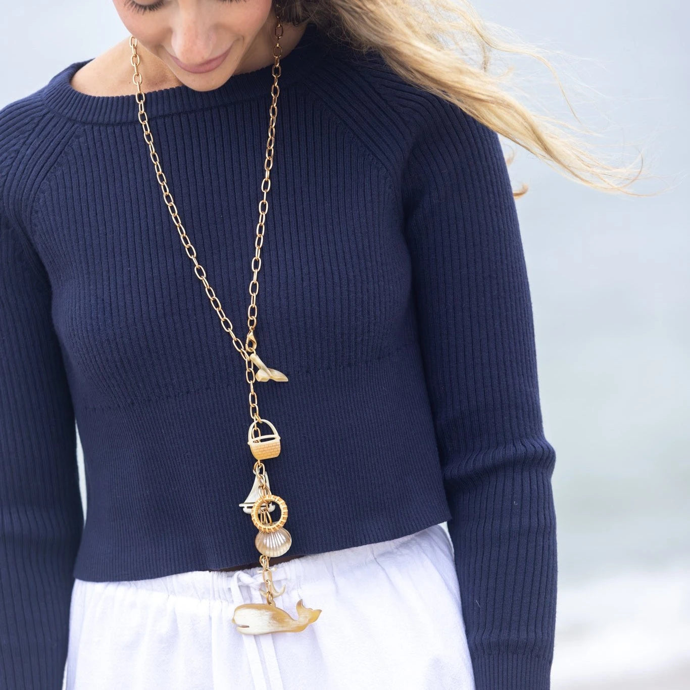 Woman Wearing WTW Necklace with nautical charms.